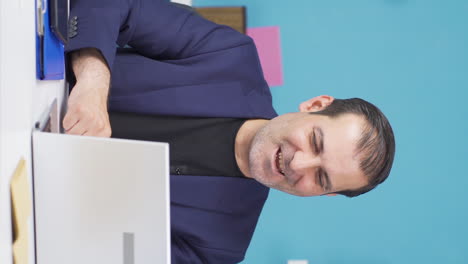 Vertical-video-of-Businessman-working-on-laptop-gets-satisfied.
